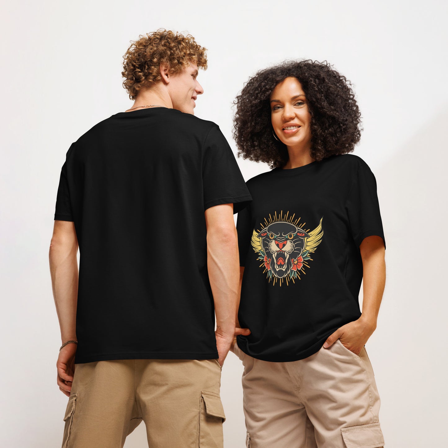 Two models wearing Pet Treasures Studio wild cat organic cotton t-shirt in black with bold roaring cat front print