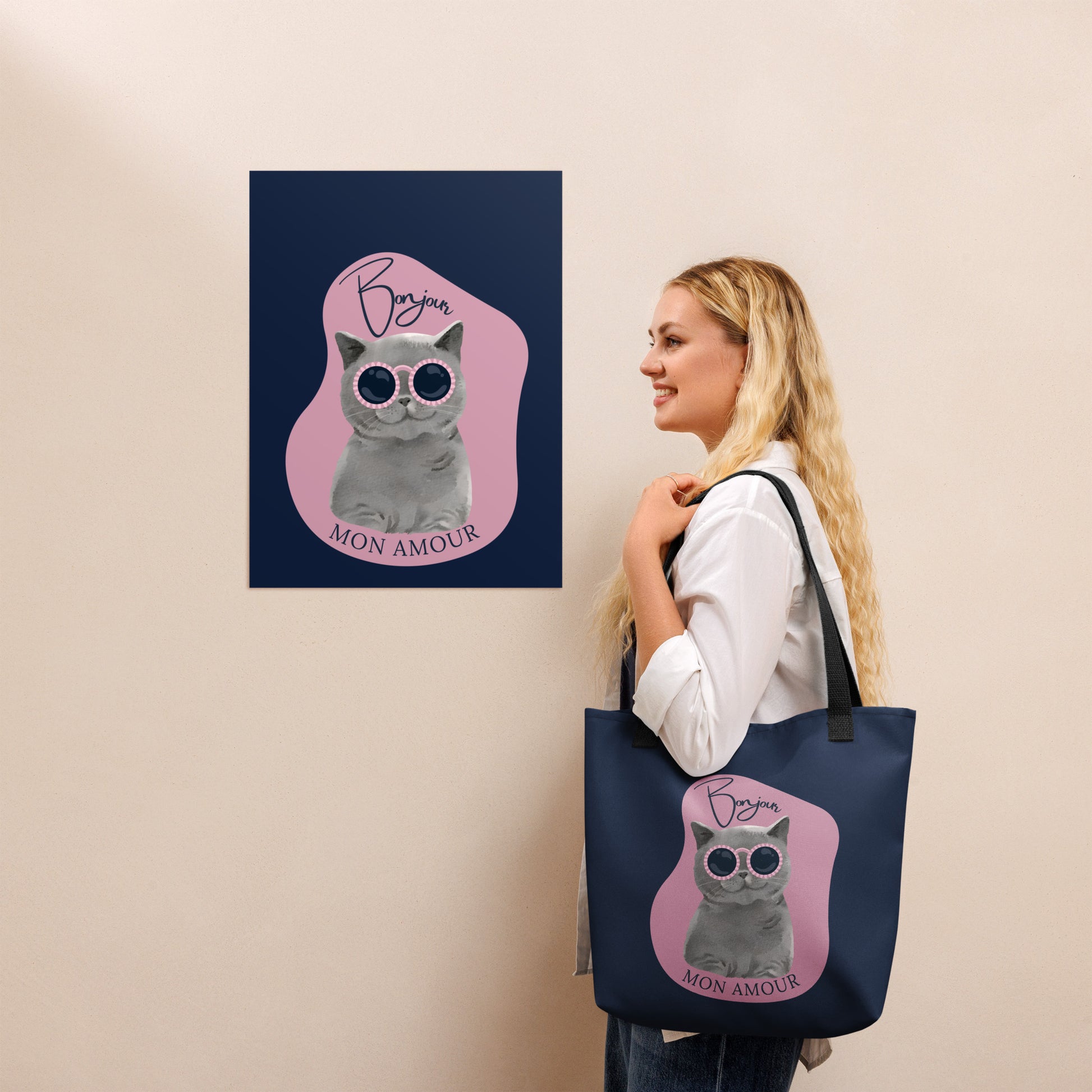 Woman carrying navy Pet Treasures Studio Bonjour Mon Amour cat bag with cat wearing sunglasses design