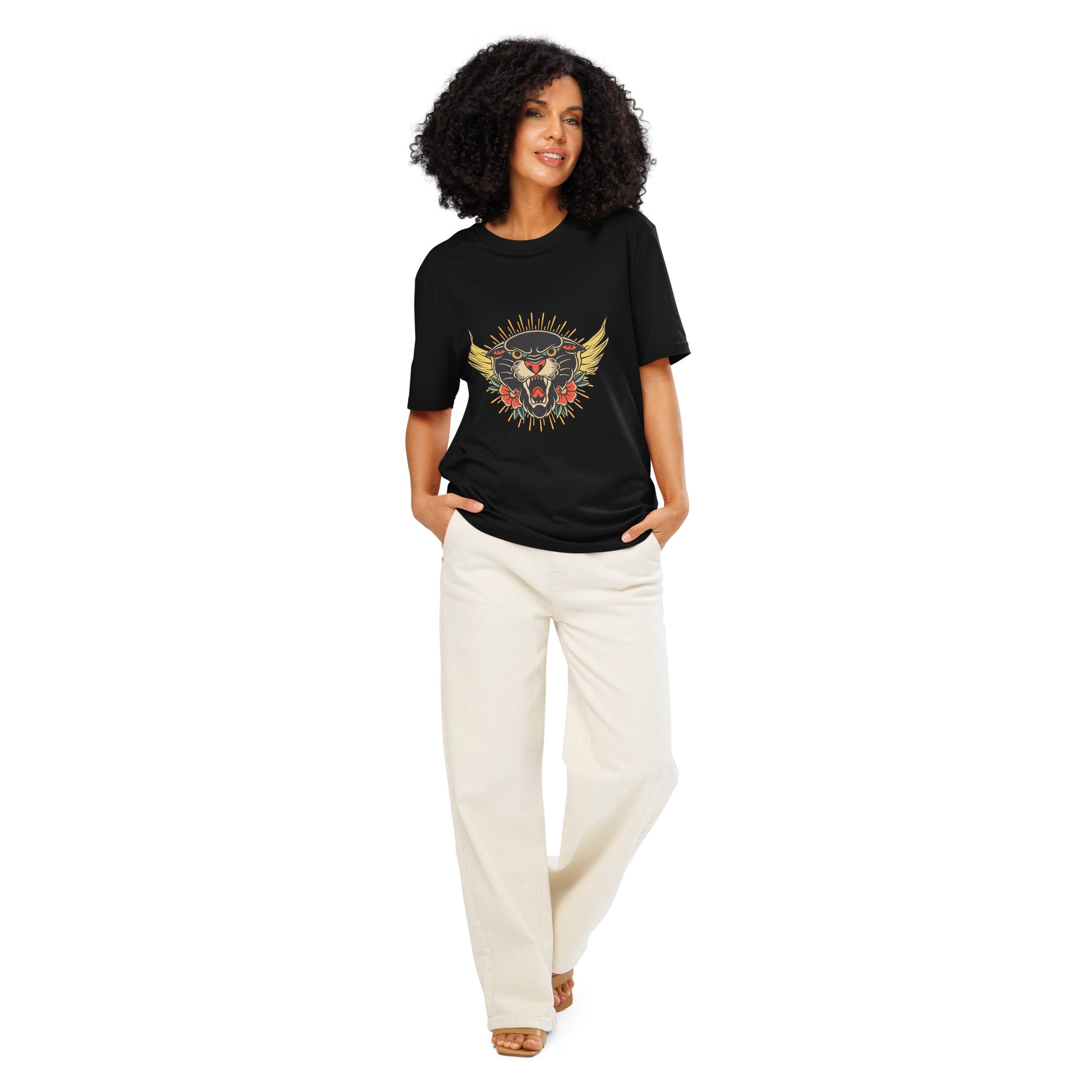 Pet Treasures Studio model wearing black wild cat organic cotton t-shirt with colourful feline sun graphic and cream trousers