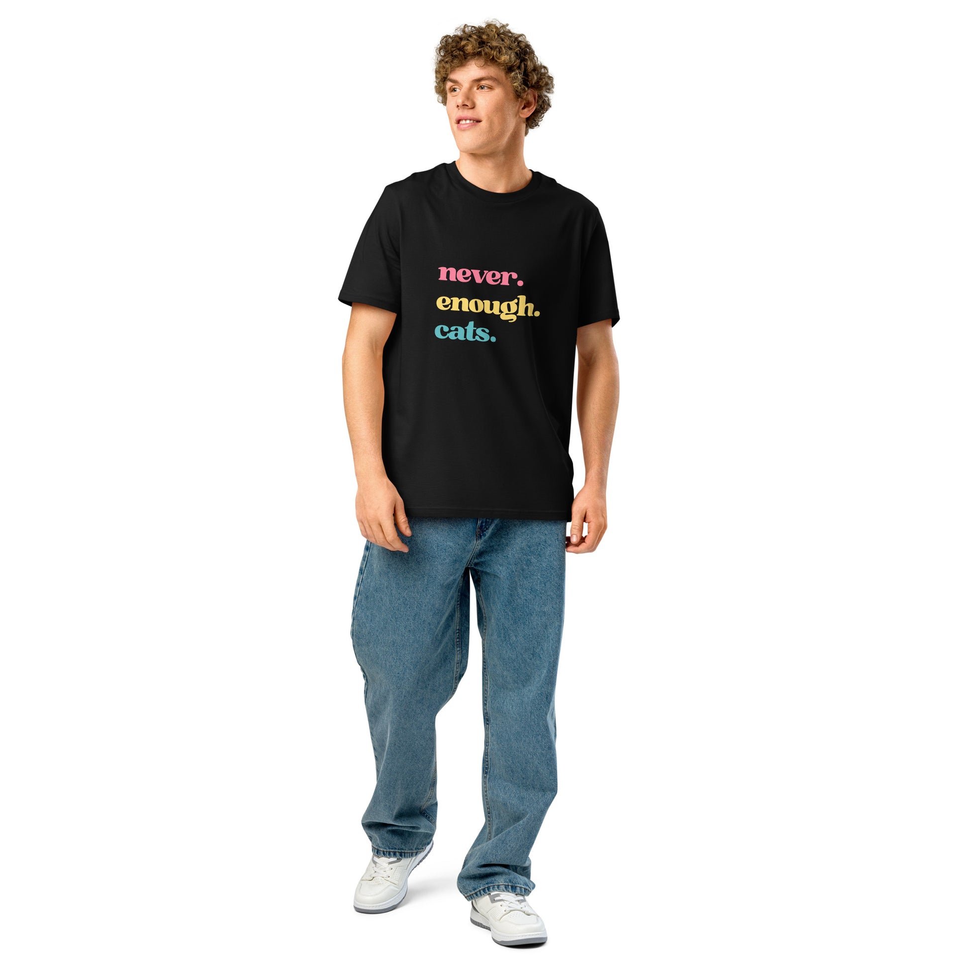 Man wearing a black never enough cats tee displaying vibrant text in colourful letters