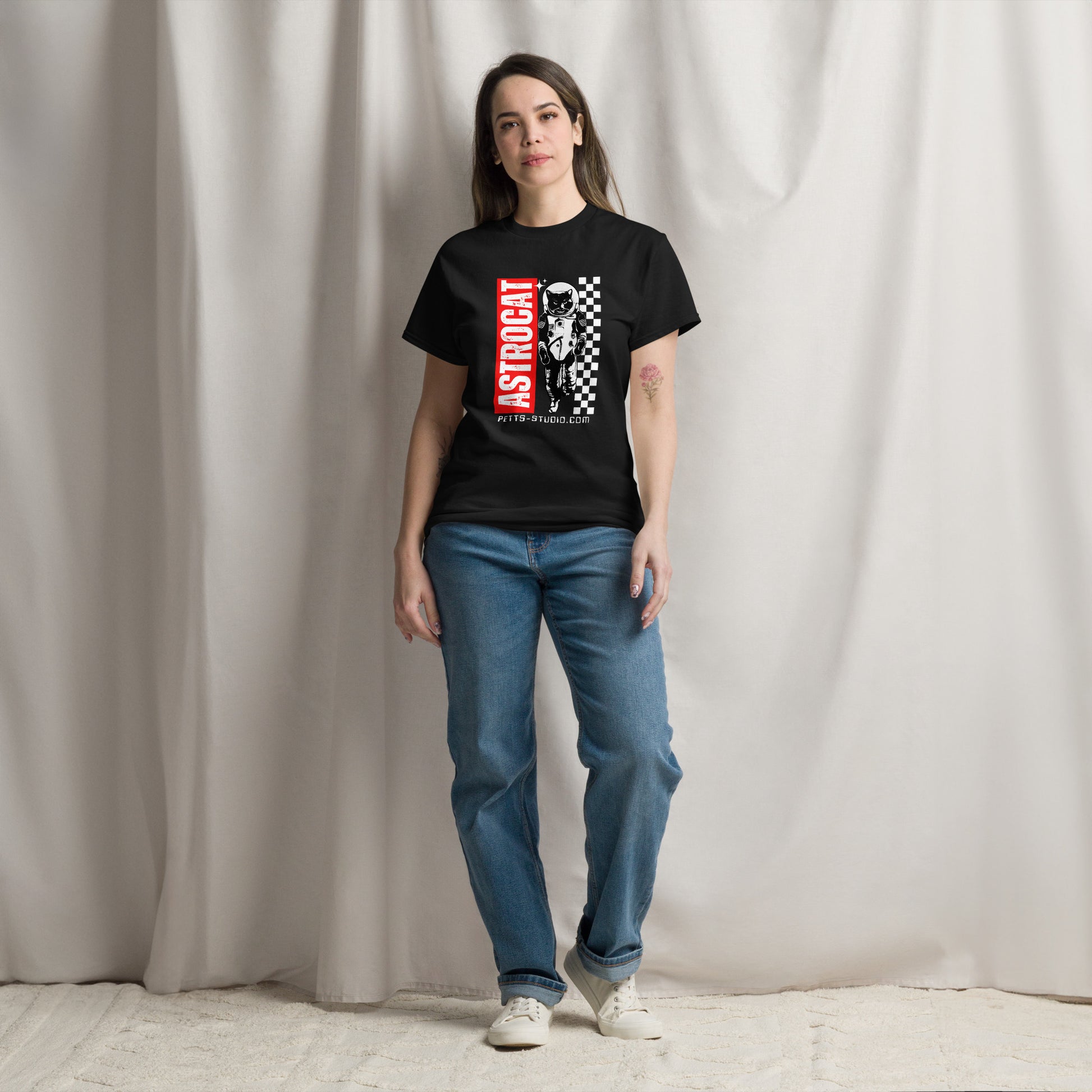 Pet Treasures Studio black cat astronaut graphic tee worn by model showing astronaut cat print and chequered panel