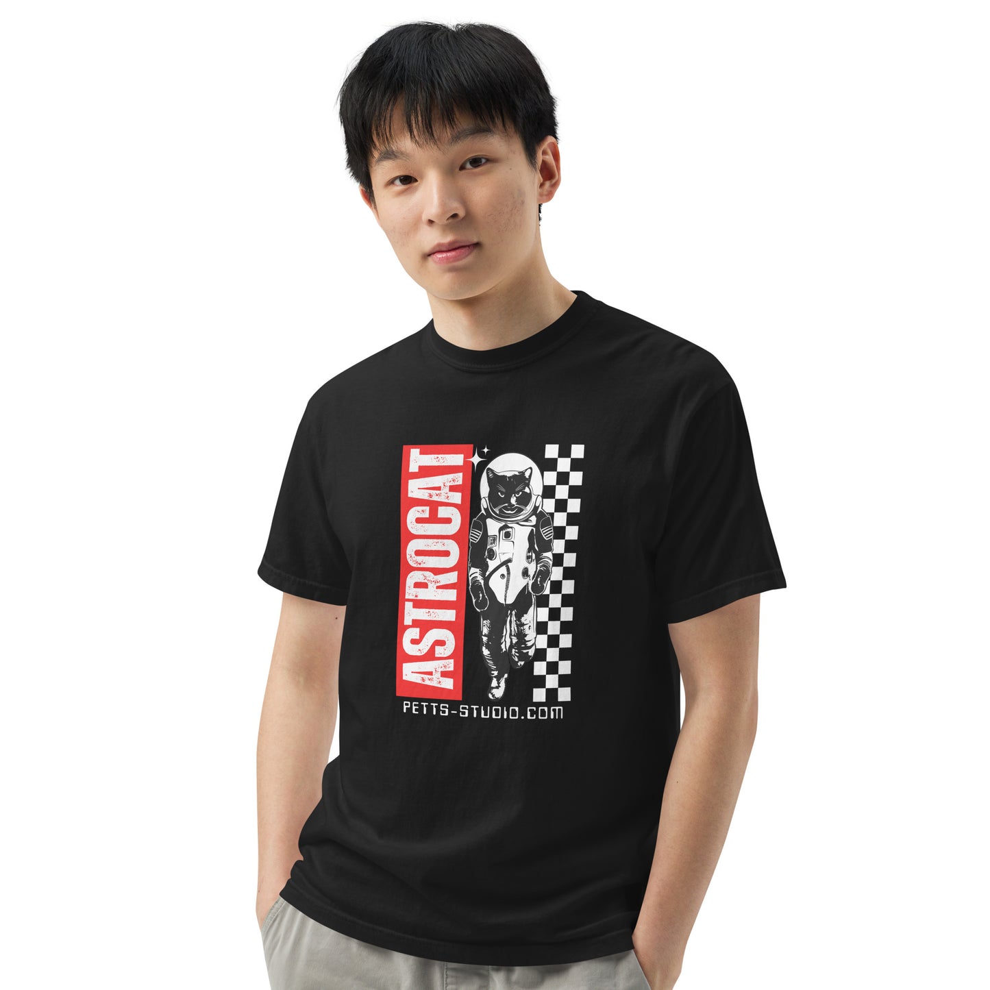 Young man wearing Pet Treasures Studio black premium feline astronaut t-shirt with ASTROCAT graphic and chequered panel