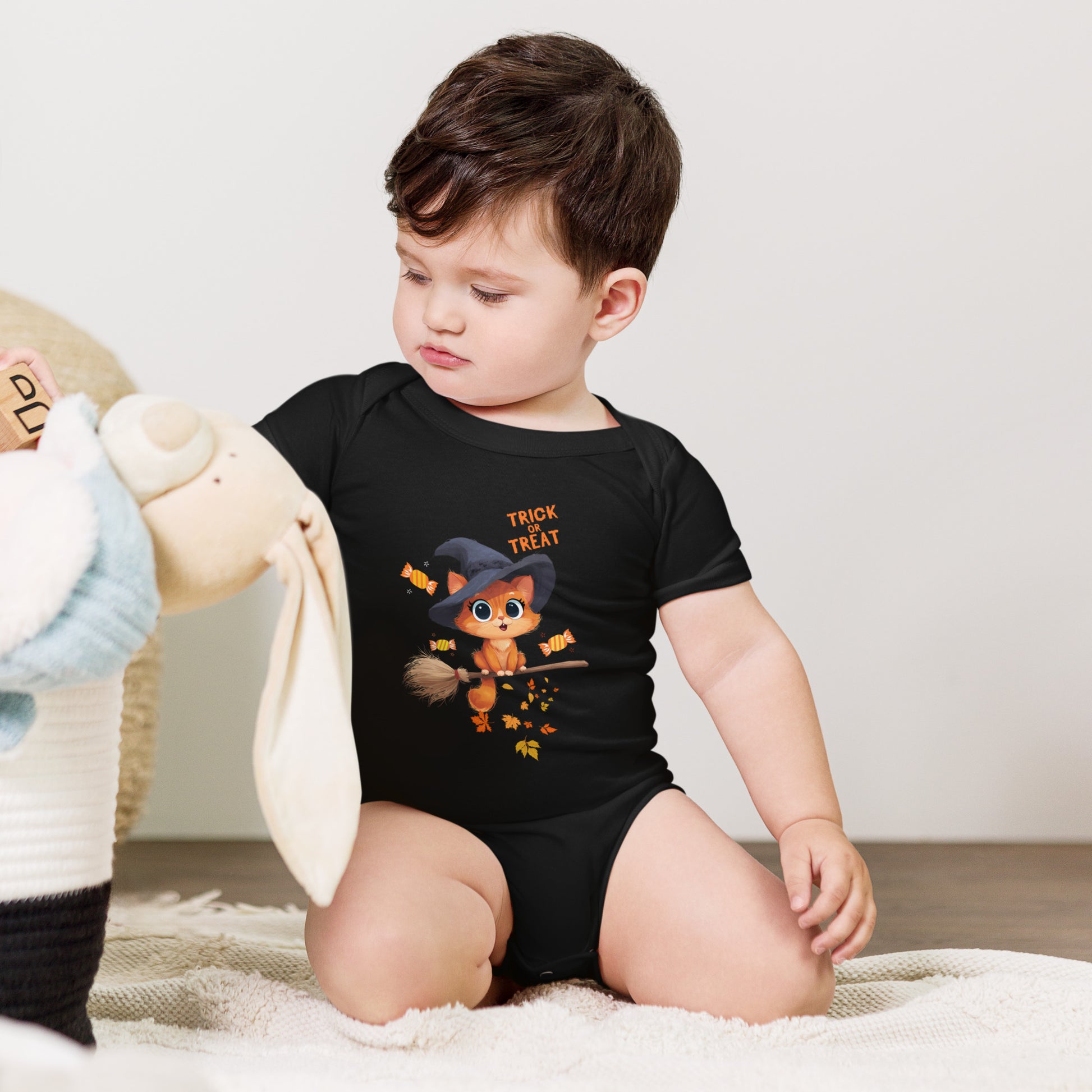 Child wearing a Trick or Treat Baby Bodysuit Animal Design featuring a cute witch character