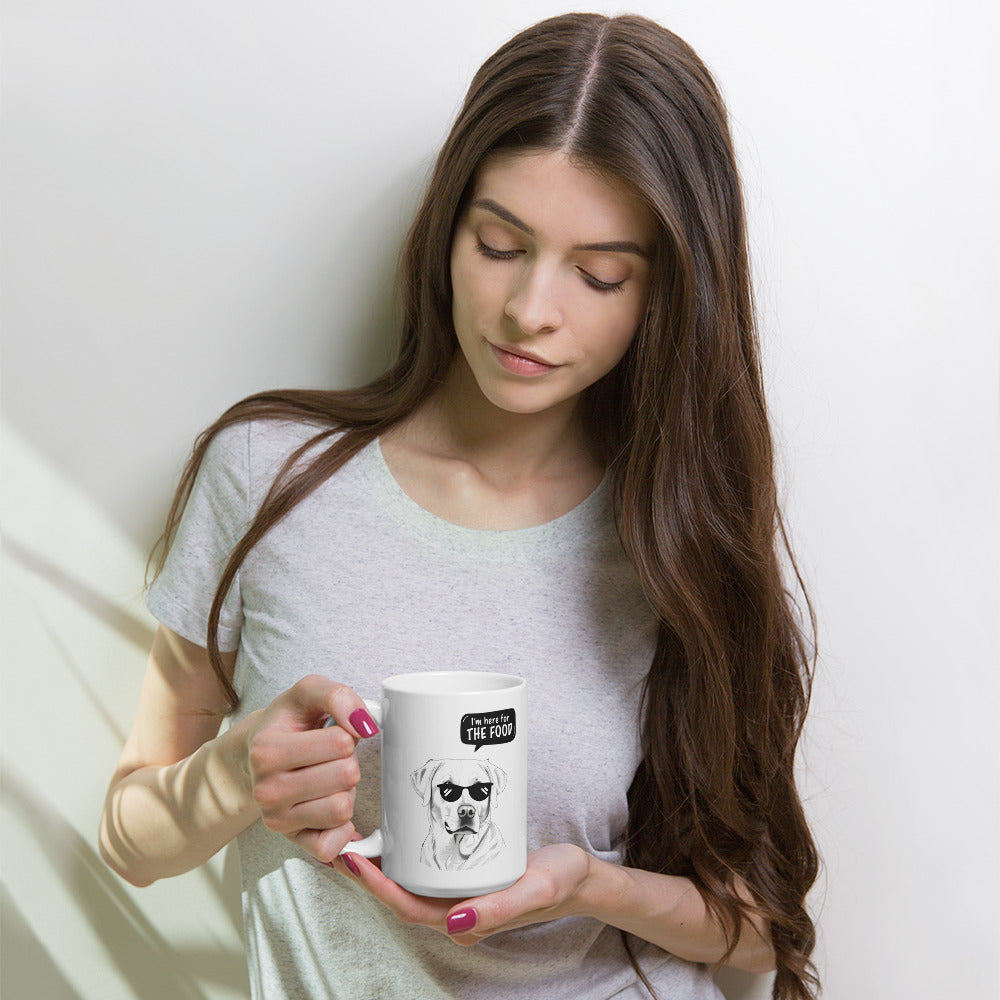Woman holding a funny labrador mug with a black and white dog illustration and text bubble